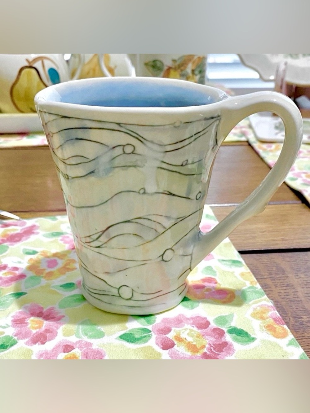 Studio Pottery Mug of ocean blue, green & black lines & circles. Unique handle.
